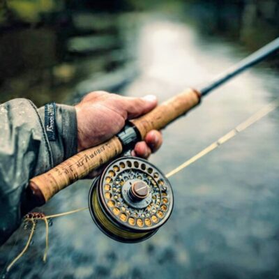 Fly Fishing scene alongside a river